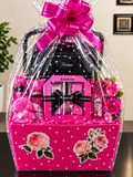 Bebe Glam Gift Basket with hot pink polka dot basket, bebe perfume set, black fashion purse, wrapped in cellophane with fuchsia bow