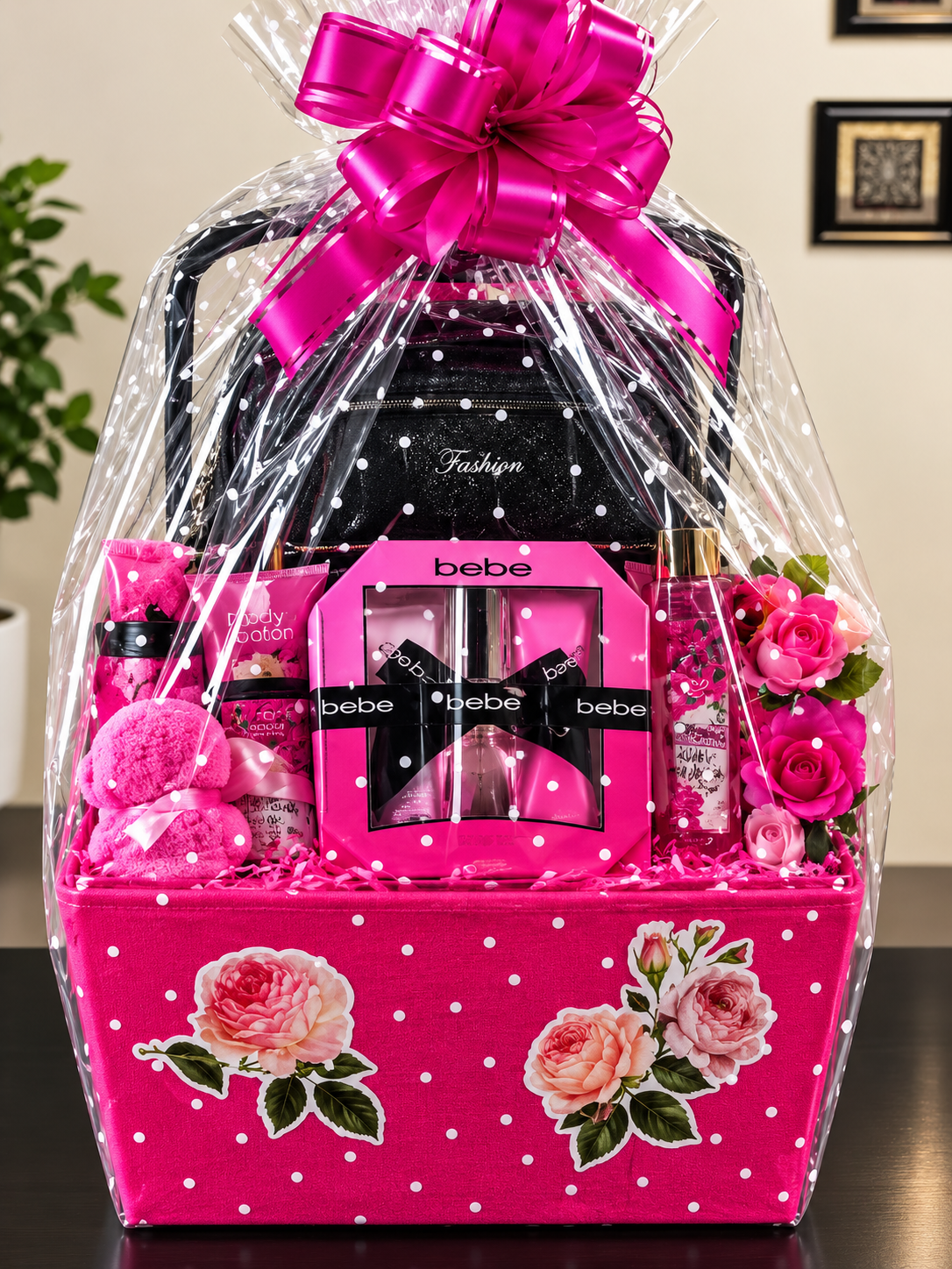 Bebe Glam Gift Basket with hot pink polka dot basket, bebe perfume set, black fashion purse, wrapped in cellophane with fuchsia bow
