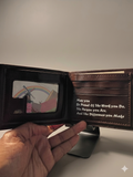 Inside view of brown leather bifold wallet showing clear photo ID window and inspirational message: May you be proud of the work you do, the person you are, and the difference you make