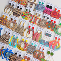Collection of colorful bohemian wooden fashion earrings in various patterns and styles
